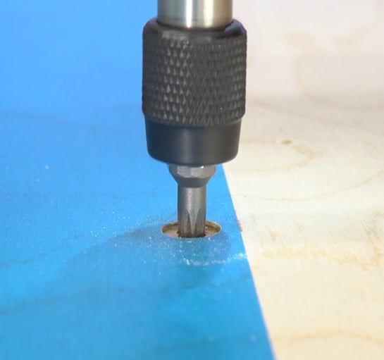 use screws to hold work for cnc machines